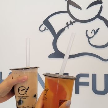 Kung Fu Tea - a woman holding two cups of tea - Bubble Tea Near Me - Ottawa, Ontario