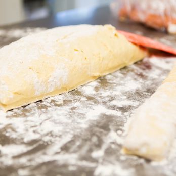 Kolache Kitchen - a roll of dough on a table - Bakeries Near Me - Temple, Texas Kolache Kitchen - a roll of dough on a table - Bakeries Near Me - Temple, Texas