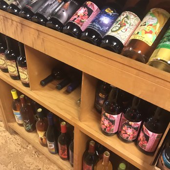 D'vine Wines - bottles of wine on shelves - Beer, Wine & Spirits Near Me - Flint, Michigan