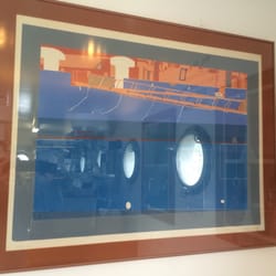Geelong Boat House - Whilst waiting for your delicious take away order enjoy the art on display. I captured the port holes reflecting on the glass.