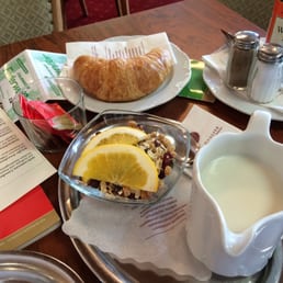 Granola with milk and a croissant