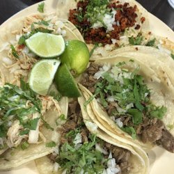 Zaza Mexican Restaurant - Taqueria Style tacos with meat smoked in our smoker for 12 hours and topped with cilantro and onion.