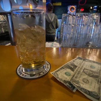 Bent Nail Bistro - a glass of whiskey and a dollar bill - Bars Near Me - Middlesex, Vermont
