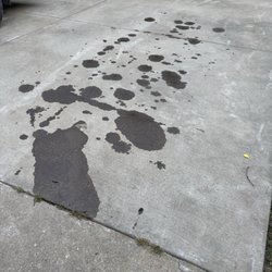 Jiffy Lube - Oil spots on my driveway after I was told issue was fixed.