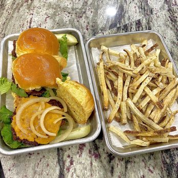 Detroit Pizza Bar - Impossible burger vegan cheese, onions, lettuce with a pickle on the side, and an order of their potato cut fries - Pizza Near Me - Detroit, Michigan Detroit Pizza Bar - Impossible burger vegan cheese, onions, lettuce with a pickle on the side, and an order of their potato cut fries - Pizza Near Me - Detroit, Michigan