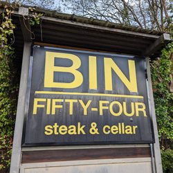 Glen Lennox Shopping Center - Exterior shot of Bin 54 Steak & Cellar, the steakhouse located at Glen-Lennox Shopping Center. I took this photo on March 28, 2023.