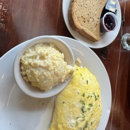 Buffalo Chicken Omelette with gouda grits and gluten free toast with fresh blueberry jam Buffalo Chicken Omelette with gouda grits and gluten free toast with fresh blueberry jam