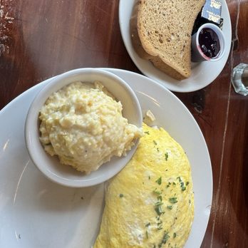 Goodness Gracious Restaurant & Catering - Buffalo Chicken Omelette with gouda grits and gluten free toast with fresh blueberry jam - Breakfast & Brunch Near Me - Murfreesboro, Tennessee Goodness Gracious Restaurant & Catering - Buffalo Chicken Omelette with gouda grits and gluten free toast with fresh blueberry jam - Breakfast & Brunch Near Me - Murfreesboro, Tennessee