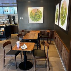 Starbucks - The only 3 tables left in the lobby. Not a very social experience.