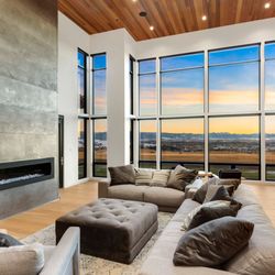 Recessed ceiling lighting creates ambiance that compliments clients natural light from living room windows.