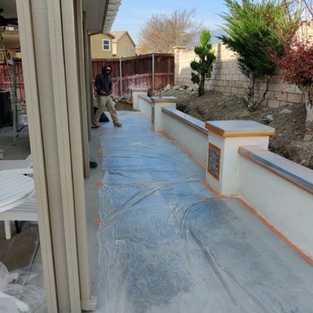 Eagle Plastering - Prepwork before fogging retaining wall - Stucco Services Near Me