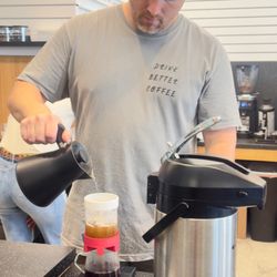Euphoria Coffee - The owner preparing a hot drink.