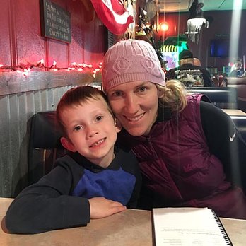 The Frog Pond - a woman and a child sitting at a table - Bars Near Me - Halma, Minnesota