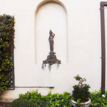 Cafe Alcazar - Buddha statue in courtyard - New American Near Me - Saint Augustine, Florida