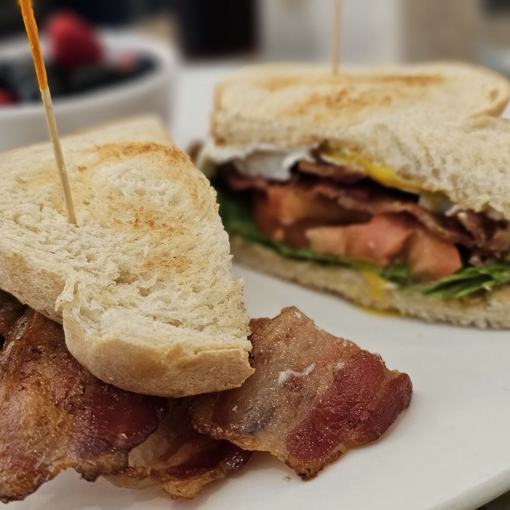 Eggsquisite Cafe - Solid BLT and over easy egg with berries cup - Breakfast & Brunch Near Me - McKinney, Texas
