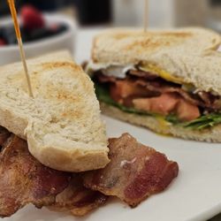Eggsquisite Cafe - Solid BLT and over easy egg with berries cup