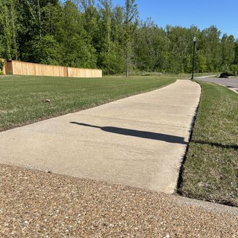 Rowe lawncare - a sidewalk with a sign on it - Lawn Services Near Me Rowe lawncare - a sidewalk with a sign on it - Lawn Services Near Me