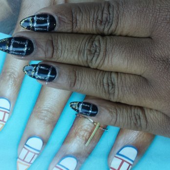 Diamond Nails & Spa - The picture in the magazine verses what I got. I wanted back silver and gold but same design. I don't think she nailed it (punny right). - Nail Technicians Near Me - Fairfield, California