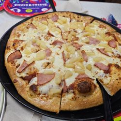 Chuck E. Cheese - Ham and pineapple pizza.