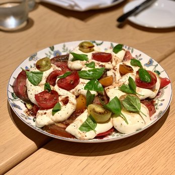 Rocca - Caprese salad made table-side with 40 yr balsamic and heirloom tomatoes - Italian Near Me - Tampa, Florida Rocca - Caprese salad made table-side with 40 yr balsamic and heirloom tomatoes - Italian Near Me - Tampa, Florida