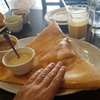 Mild 2 Spicy - Mysore Masala Dosa. Thin crepe layered w/spicy chutney and filled w/seasoned potatoes and onions. (spicy but not too spicy in my opinion.) - Indian Near Me - Chicago, Illinois Mild 2 Spicy - Mysore Masala Dosa. Thin crepe layered w/spicy chutney and filled w/seasoned potatoes and onions. (spicy but not too spicy in my opinion.) - Indian Near Me - Chicago, Illinois