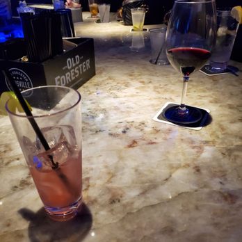 Patricks Rooftop - CranRose Mule and glass of red wine blend - Cocktail Bars Near Me - Buffalo, New York