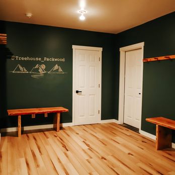 Renco - a hallway with a bench and a door - General Contractors Near Me Renco - a hallway with a bench and a door - General Contractors Near Me