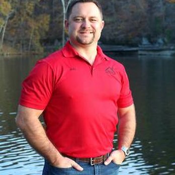 Bella Vista Contractors - a man standing in front of a lake - General Contractors Near Me Bella Vista Contractors - a man standing in front of a lake - General Contractors Near Me