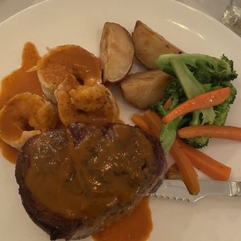 Fratelli's Trattoria - Surf and turf filet mignon and Cajun shrimp with roasted red potatoes and carrots and broccoli - Italian Near Me - Croton on Hudson, New York