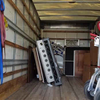 Clutter Storage - My storage items in left corner (Clutter packing boxes and dolly on right). - Self Storage Near Me Clutter Storage - My storage items in left corner (Clutter packing boxes and dolly on right). - Self Storage Near Me