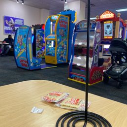 a game room with arcade machines a game room with arcade machines