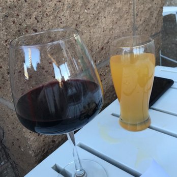 Sandia Saloon - a glass of wine and a glass of orange juice - Beer Bar Near Me - Albuquerque, New Mexico