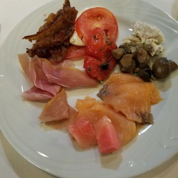 Fogo de Chão - Chicken salad, smoked salmon, watermelon, and marinated mushrooms. - Brazilian Near Me - Addison, Texas