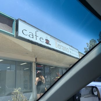 Cafe Teramo - a woman taking a picture through a car window - Bakeries Near Me - North Hollywood, California Cafe Teramo - a woman taking a picture through a car window - Bakeries Near Me - North Hollywood, California