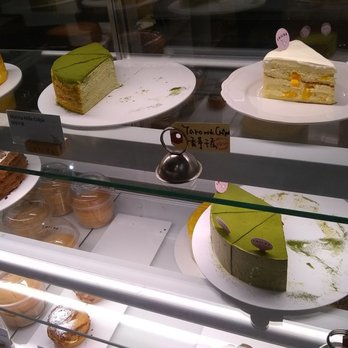 Chicha Restaurant - Desserts for n display. They have Mille Crepes cake and cheesecake. - Desserts Near Me - Montreal, Quebec