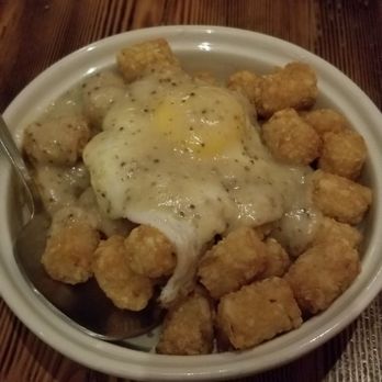 Radiator Whiskey - Tots with a fried egg and gravy. BOMB. - New American Near Me - Seattle, Washington