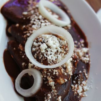 Fonda La Catrina - Enchilada de mole poblano. Their mole sauce is amazing, I'd put this stuff on everything! - Mexican Near Me - Seattle, Washington
