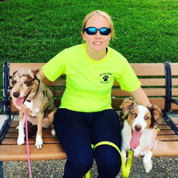 Aussie Mom Pet Sitting - Roxy and Hurley with Ashley during "Thursday Squared" in downtown lakeland, taking a break on a bench before checking out the food trucks - Pet Boarding Near Me