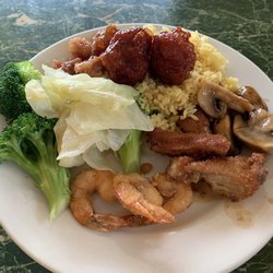 Broccoli, steamed cabbage, Kung Pao chicken, sautéed mushrooms, breaded shrimp, peanut chicken, house fried rice, and two shrimp balls