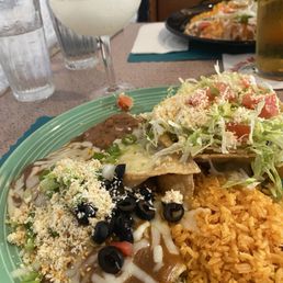 Cheese enchilada/shredded beef taco combo platter with frozen margarita Cheese enchilada/shredded beef taco combo platter with frozen margarita