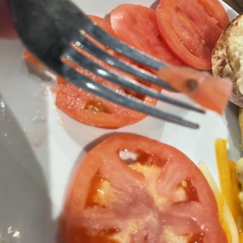 Another Broken Egg Cafe - Sliced tomatoes, should have cut off stem mark. - Breakfast & Brunch Near Me - West Chester Township, Ohio Another Broken Egg Cafe - Sliced tomatoes, should have cut off stem mark. - Breakfast & Brunch Near Me - West Chester Township, Ohio