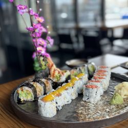 Sapporo Sushi & Grill - Shrimp tempura, mango and salmon and spicy tuna roll.