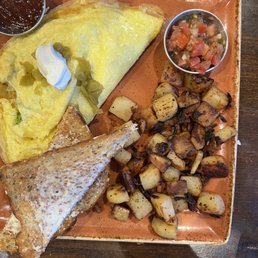 Chili Chorizo omelet with breakfast potatoes. Chili Chorizo omelet with breakfast potatoes.