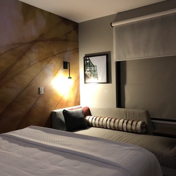 Cambria Hotel Omaha Downtown - Floating king platform bed, chaise and privacy window covers in my beautiful Cambria room. - Hotels Near Me - Omaha, Nebraska Cambria Hotel Omaha Downtown - Floating king platform bed, chaise and privacy window covers in my beautiful Cambria room. - Hotels Near Me - Omaha, Nebraska
