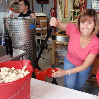 Tin Lizzie Wineworks - a woman holding a bucket of wine - Wineries Near Me - Clarksville, Maryland Tin Lizzie Wineworks - a woman holding a bucket of wine - Wineries Near Me - Clarksville, Maryland