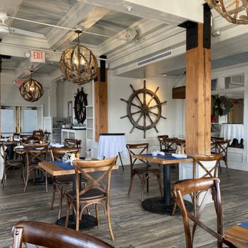 Ferryman’s Grille - tables and chairs in a restaurant - Diners Near Me - Port Jefferson, New York
