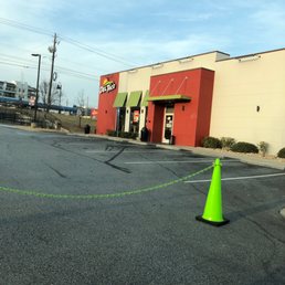 a cone in the middle of a parking lot a cone in the middle of a parking lot