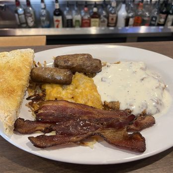 Remington's Tavern - The all meat breakfast, with bacon, sausage, and country fried steak, hash browns and sourdough toast - Bars Near Me - Cross Plains, Wisconsin Remington's Tavern - The all meat breakfast, with bacon, sausage, and country fried steak, hash browns and sourdough toast - Bars Near Me - Cross Plains, Wisconsin
