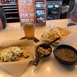 Fried avocado taco, side of street corn, and salsa - cold Cerveza Fried avocado taco, side of street corn, and salsa - cold Cerveza