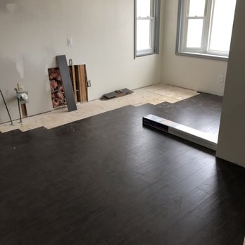 Nailed It Construction - an empty room with wood floors - General Contractors Near Me